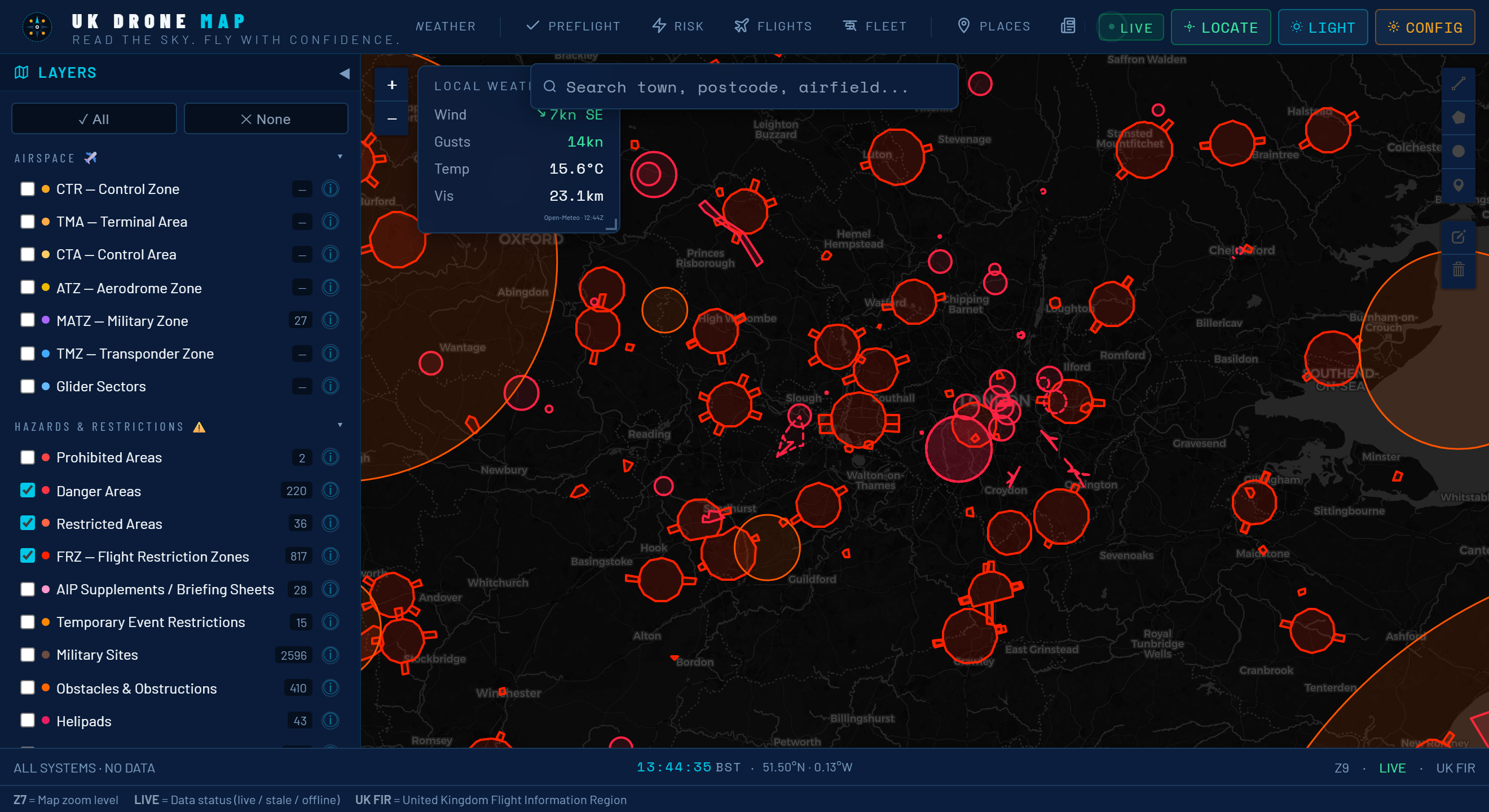 UK Drone Map interface centred on south-east England, showing dozens of red Flight Restriction Zone circles and danger and restricted areas across the map, with the Layers panel open on the left listing the airspace and hazard layer groups and a live local-weather widget at the top